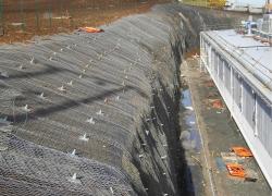 Vulcan Anchors holding down mesh on sloping ground